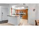 Well-lit kitchen boasting granite countertops, stainless steel appliances, and light wood cabinetry at 10101 N Arabian Trl # 1005, Scottsdale, AZ 85258