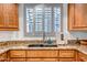 Close-up on a modern kitchen sink with granite countertops, stylish faucet, and ample natural light at 10101 N Arabian Trl # 1005, Scottsdale, AZ 85258