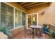 Outdoor patio area with tile floors, dining table, and beautiful desert landscape at 10101 N Arabian Trl # 1005, Scottsdale, AZ 85258