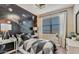 Cozy bedroom with space themed wallpaper, stylish decor, and ample natural light at 10544 W Bloch Rd, Tolleson, AZ 85353