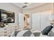 Stylish bedroom showcasing a galaxy-themed artwork and light-filled interior with double door closet at 10544 W Bloch Rd, Tolleson, AZ 85353