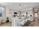 Modern kitchen with a large island, stainless steel appliances, and an eat-in breakfast bar at 10544 W Bloch Rd, Tolleson, AZ 85353