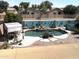 Elevated view of the backyard swimming pool, rock feature, and poolside lounge area at 11121 E Sombra Ave, Mesa, AZ 85212