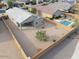 Aerial view of a gravel backyard with a pool and covered patio at 1127 E Tyler Ln, Casa Grande, AZ 85122