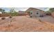 Large gravel backyard with partial privacy fence and minimal desert landscaping at 1127 E Tyler Ln, Casa Grande, AZ 85122