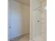 Bright bathroom with a white tiled shower and a well-lit interior at 1127 E Tyler Ln, Casa Grande, AZ 85122