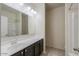 Bathroom featuring a vanity with dark cabinets and a shower-tub combination at 1127 E Tyler Ln, Casa Grande, AZ 85122