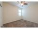 This bedroom offers neutral colors and carpeting, providing a blank canvas for personalization at 1127 E Tyler Ln, Casa Grande, AZ 85122
