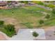 Ariel shot of community park featuring a basketball court, grassy field, and walking path at 1127 E Tyler Ln, Casa Grande, AZ 85122
