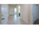 Inviting entryway featuring neutral tile flooring, a coat closet, and access to adjacent rooms at 1127 E Tyler Ln, Casa Grande, AZ 85122