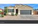 Charming single-story home with a two-car garage and low-maintenance landscaping at 1127 E Tyler Ln, Casa Grande, AZ 85122