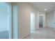 Bright hallway with tile flooring, connecting various rooms in the home at 1127 E Tyler Ln, Casa Grande, AZ 85122