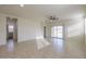 The spacious living room features tile floors and sliding glass doors to the backyard at 1127 E Tyler Ln, Casa Grande, AZ 85122