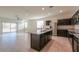 The open-concept living room offers tile floors and access to the backyard through sliding glass doors at 1127 E Tyler Ln, Casa Grande, AZ 85122