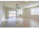 The spacious living room features tile floors, recessed lighting, and sliding doors to the backyard at 1127 E Tyler Ln, Casa Grande, AZ 85122