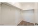 Spacious walk-in closet with carpeting, features rods and shelving for organized storage and ample space at 1127 E Tyler Ln, Casa Grande, AZ 85122