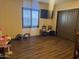 Play room with hardwood floors, and a built-in play kitchen at 12937 W Calle De Sol --, Peoria, AZ 85383
