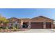 Stunning single-story home featuring a stone facade, three-car garage, and well-maintained landscaping at 12937 W Calle De Sol --, Peoria, AZ 85383