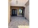 Elegant double front doors with decorative glass, set in a covered entryway with brick paving at 12937 W Calle De Sol --, Peoria, AZ 85383