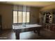 Luxurious game room with a billiard table, custom cabinetry, and natural light at 12937 W Calle De Sol --, Peoria, AZ 85383