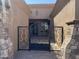 Ornate wrought iron gate providing security and curb appeal to this luxury home at 12937 W Calle De Sol --, Peoria, AZ 85383