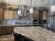Well-appointed kitchen with granite counters, decorative lighting and stainless steel appliances at 12937 W Calle De Sol --, Peoria, AZ 85383