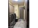 Laundry room featuring modern washer and dryer, storage cabinets, and tile flooring at 12937 W Calle De Sol --, Peoria, AZ 85383