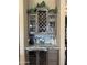 Wine bar with storage, beverage refrigerator, granite counters and decorative backsplash at 12937 W Calle De Sol --, Peoria, AZ 85383