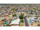 Aerial perspective showing nearby businesses, houses with pools, and the layout of the surrounding neighborhood at 1308 S Spur --, Mesa, AZ 85204