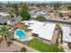 This high angle shows a home with in-ground pool, boat, manicured lawn and mature landscaping at 1308 S Spur --, Mesa, AZ 85204