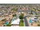 A high angle captures a neighborhood with an in-ground pool, boat, and well-maintained landscaping at 1308 S Spur --, Mesa, AZ 85204