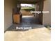 Covered back porch area with storage room, offering ample space for outdoor activities at 1308 S Spur --, Mesa, AZ 85204