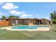 This home has a backyard with a pool and synthetic grass. Perfect for relaxation and fun! at 1308 S Spur --, Mesa, AZ 85204