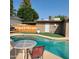 Private backyard featuring a sparkling pool, RV gate, and fenced yard at 1308 S Spur --, Mesa, AZ 85204