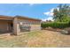 View of the backyard and utility shed, ladder and foliage at 1308 S Spur --, Mesa, AZ 85204