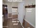 Pool bathroom with towel hooks and tiled floors, conveniently located near the pool area at 1308 S Spur --, Mesa, AZ 85204