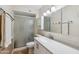 Updated bathroom featuring a new vanity, lighting, and a shower with glass doors at 1308 S Spur --, Mesa, AZ 85204