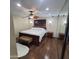 Traditional bedroom with hardwood floors, mirrored closet, and dark furniture at 1308 S Spur --, Mesa, AZ 85204