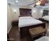 Comfortable bedroom with dark wood flooring and ample closet space at 1308 S Spur --, Mesa, AZ 85204