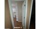 Bedroom 2 featuring wood floors and built in shelves perfect for storage at 1308 S Spur --, Mesa, AZ 85204