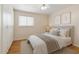 Bright bedroom featuring a large window and ample closet space with light walls and ceiling fan at 1308 S Spur --, Mesa, AZ 85204