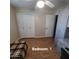 Bedroom with wood-look flooring and double door closet at 1308 S Spur --, Mesa, AZ 85204