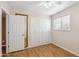 Cozy bedroom with hardwood floors, closet, and bright natural light from window at 1308 S Spur --, Mesa, AZ 85204