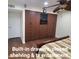 Bedroom featuring built-in drawers, closed shelving & tv entertainment at 1308 S Spur --, Mesa, AZ 85204