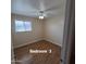 Bedroom 3 with wood floors and a ceiling fan at 1308 S Spur --, Mesa, AZ 85204