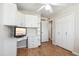 Bedroom featuring hardwood flooring, fan, and built in desk and closet storage at 1308 S Spur --, Mesa, AZ 85204