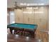 Bonus Room with storage cabinets, tile floors, and pool table, this space offers flexible use at 1308 S Spur --, Mesa, AZ 85204