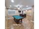 The Bonus room features a billiards table, a dining area, tile flooring, and plenty of storage at 1308 S Spur --, Mesa, AZ 85204