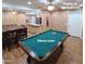 A bonus room is equipped with a pool table, cabinets, and access to the kitchen for ultimate entertaining at 1308 S Spur --, Mesa, AZ 85204