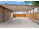 Spacious carport providing covered parking with a secure gated entrance offering additional storage at 1308 S Spur --, Mesa, AZ 85204